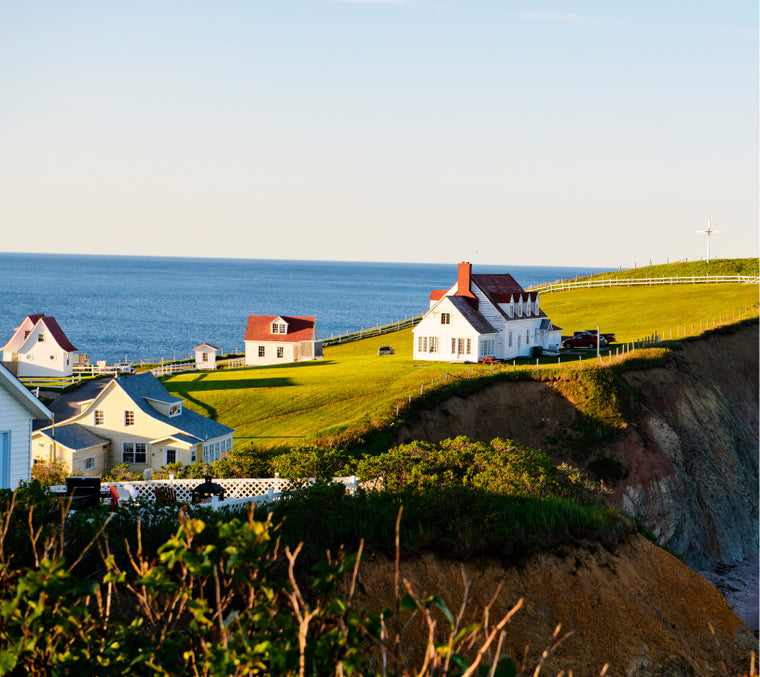 Landscape of Bonaventure Island, fisherman houses, and the Perce Rock in Gaspésie, Quebec